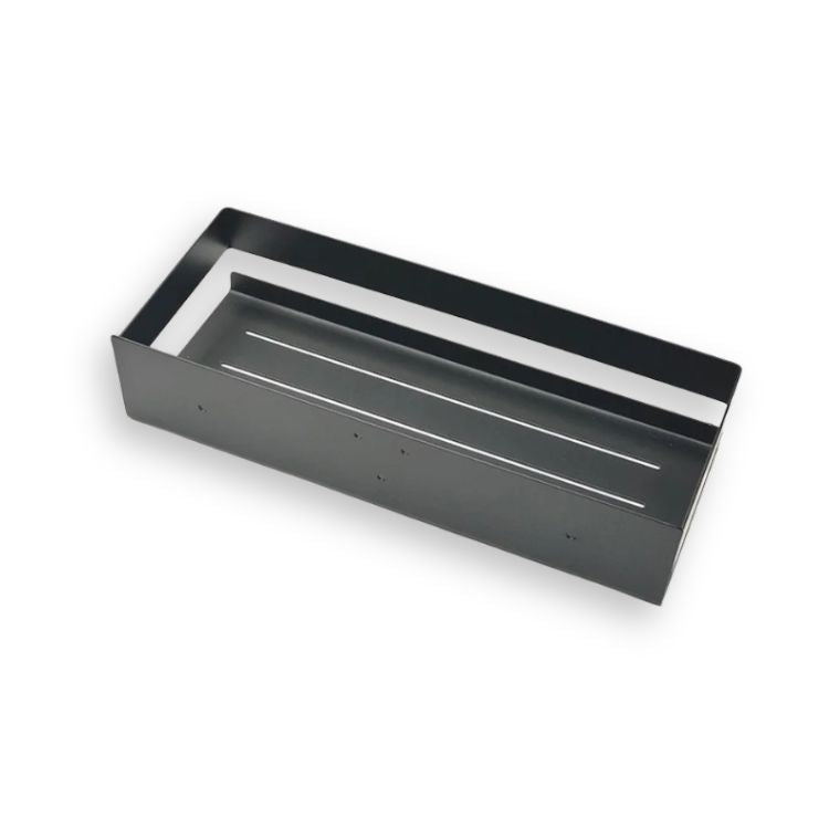Empty black shower shelf with drainage slits.