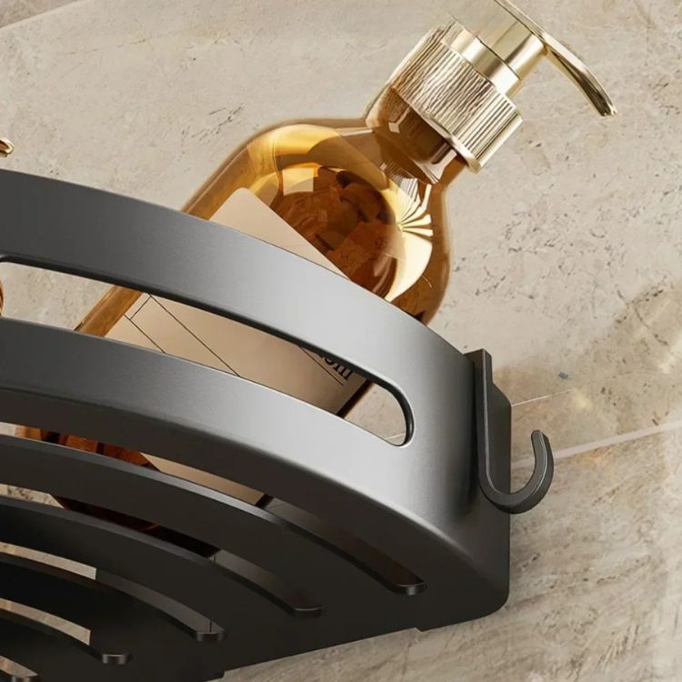 Close-up of corner shower caddy with hook.