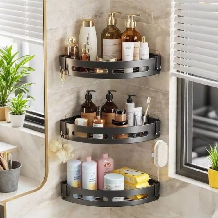 Three-tier corner shower caddy with bath items.