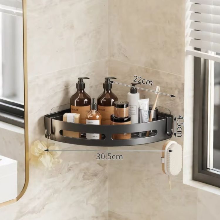 Wall-mounted corner shower caddy with bottles.