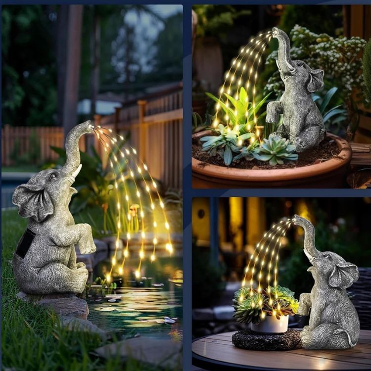 Multiple glowing elephant statues displayed in a garden.