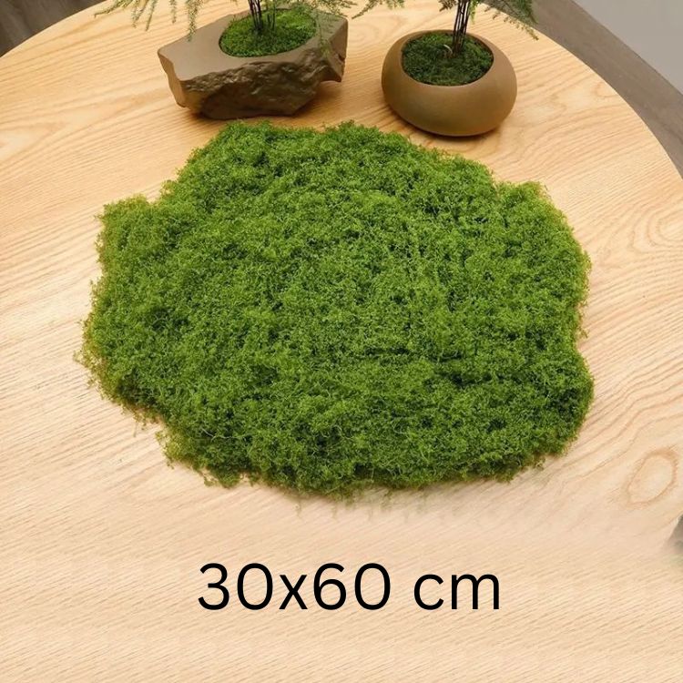 Medium-sized 30x60 cm round patch of fake moss on a tabletop for home garden accents.