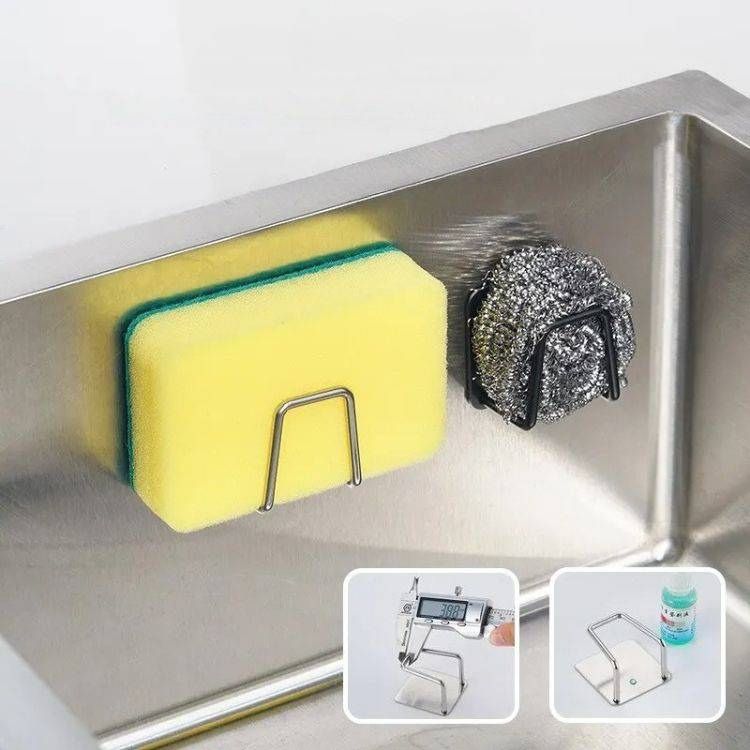 Sink sponge rack holding a yellow sponge and metal scrubber in a stainless steel sink.