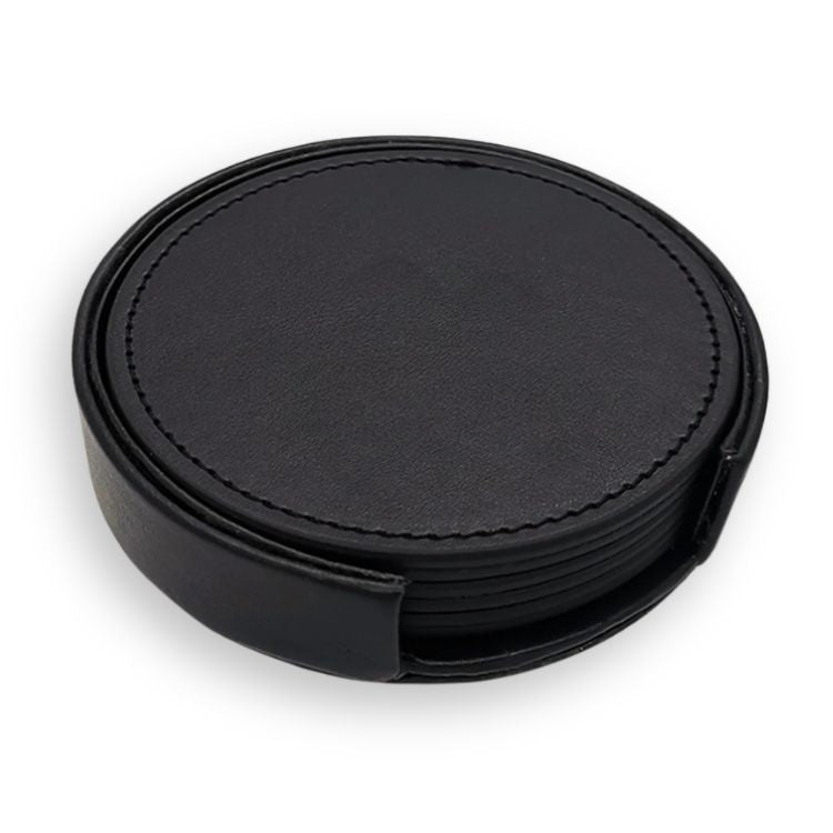 Simple black drink coasters stacked in a round leather holder.