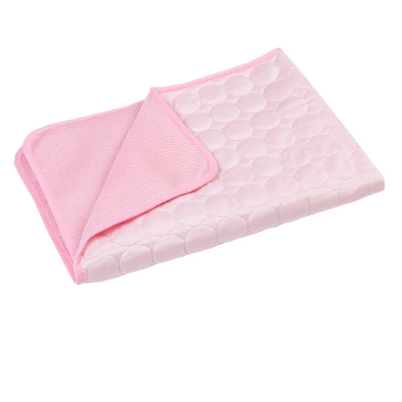 Folded pink dog cooling mat shown in detail.