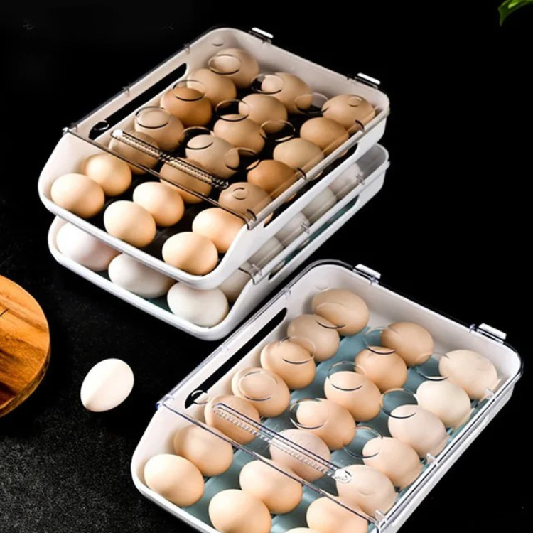 Three egg holders for fridge on display, filled with brown and white eggs.
