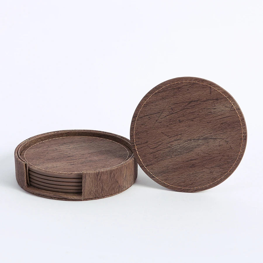 Six brown round wood-grain coasters with holder, one separate.