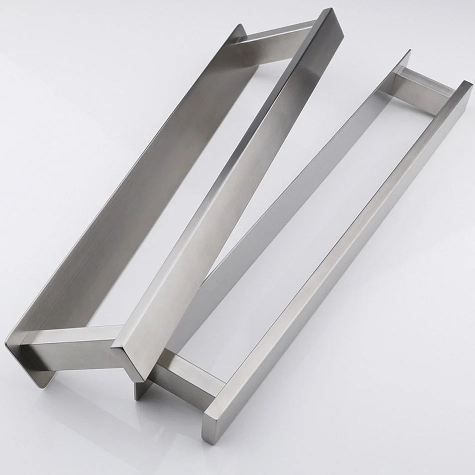 Stainless steel self adhesive towel rail disassembled into base and frame pieces.