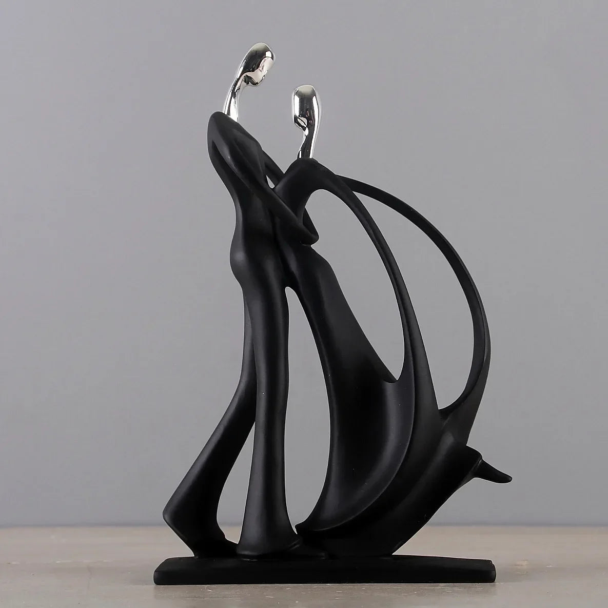 Black dancing figurine, abstract figures.