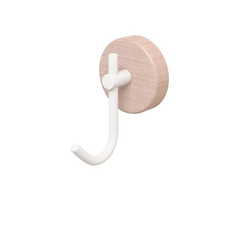 Light wooden coat hook with a white arm.
