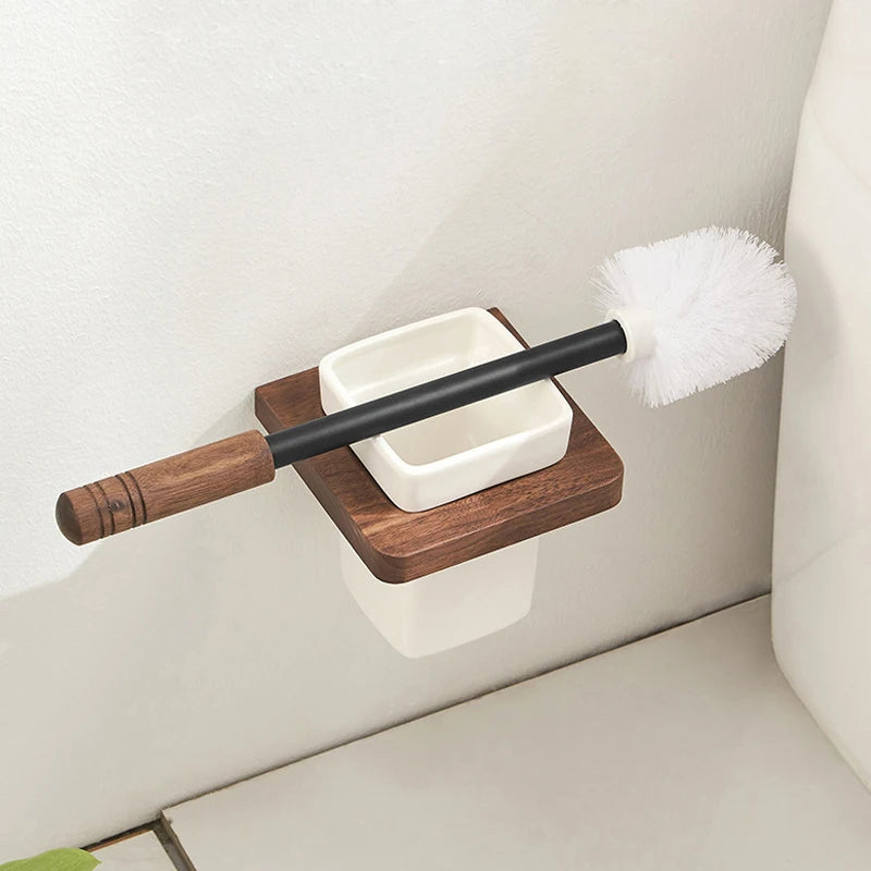 A wall-mounted wooden toilet brush holder with the brush partially removed.