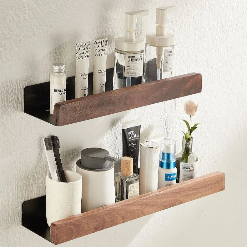 Two floating wood shelves mounted on a wall, organized with bathroom essentials.