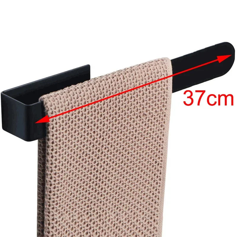 Adhesive towel ring with beige towel, 37cm width.