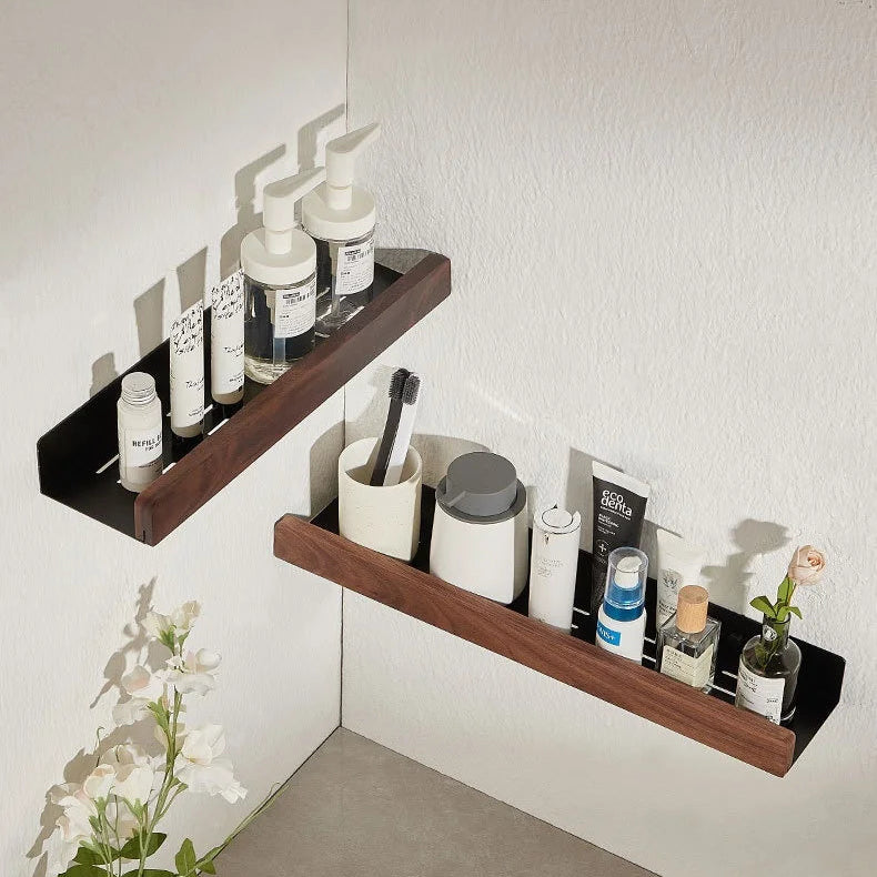 Two floating wood shelves with bathroom items in a corner view.