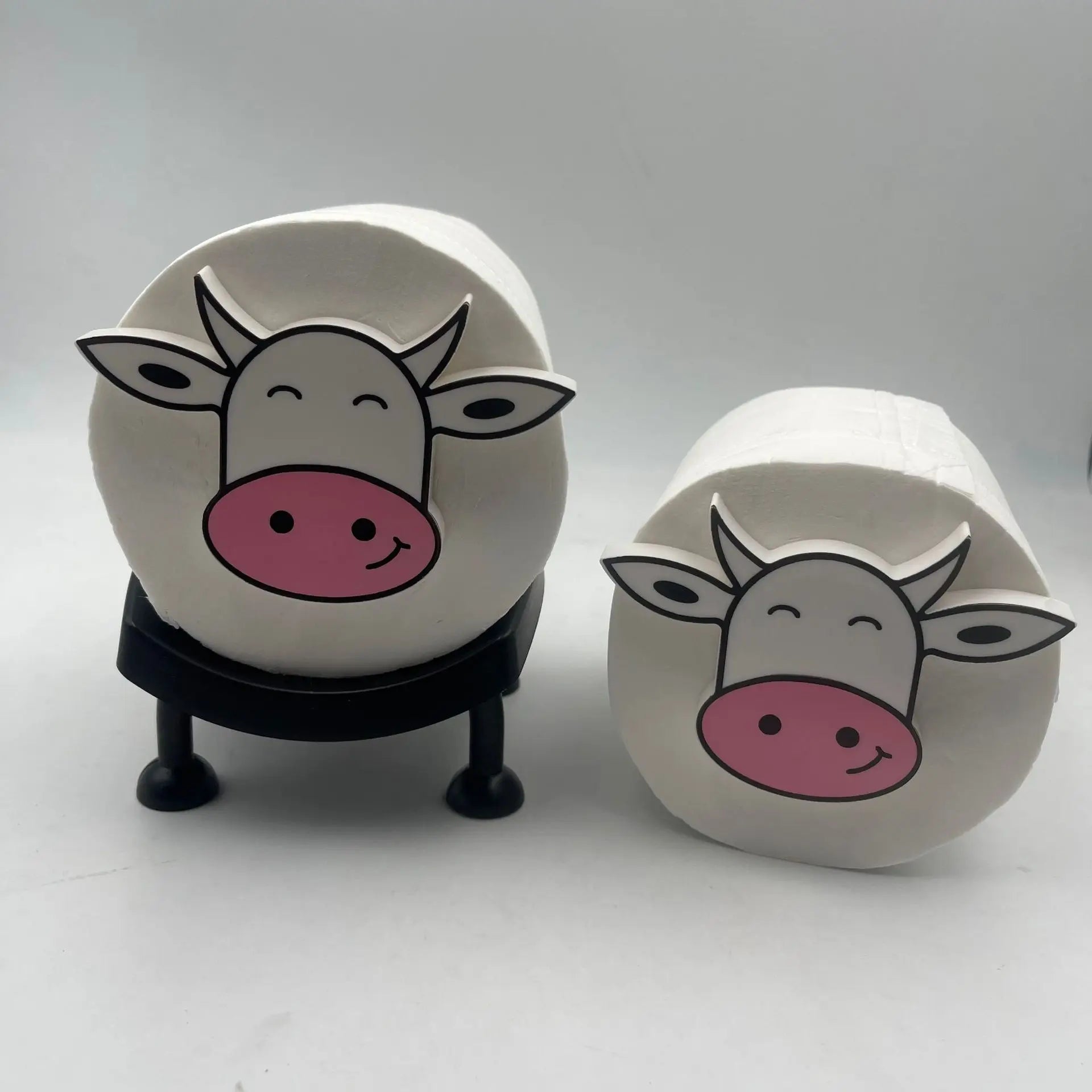 A black U-shaped toilet roll holder, shown with dimensions.