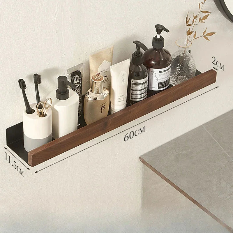 Long floating wood shelf organized with bathroom essentials, displaying dimensions.