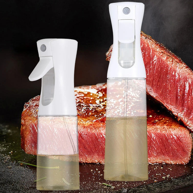 Two oil sprayer bottles misting oil over grilled steak.