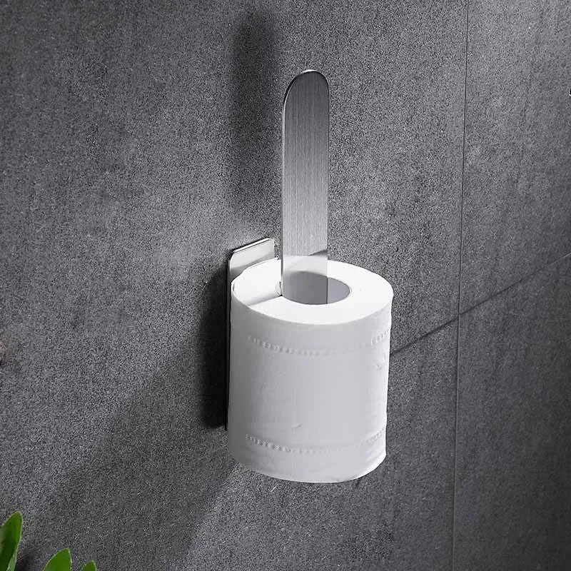 Vertical adhesive towel ring holding a toilet paper roll.