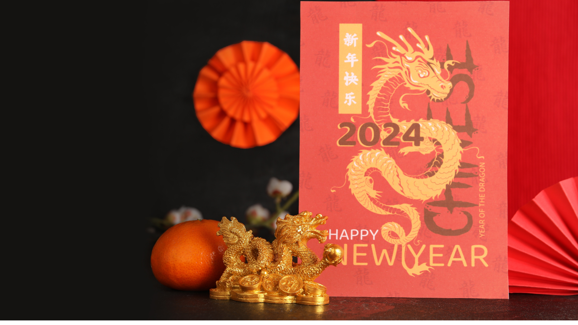 A 2024 Happy Chinese New year card which features alongside a dragon and some red fans