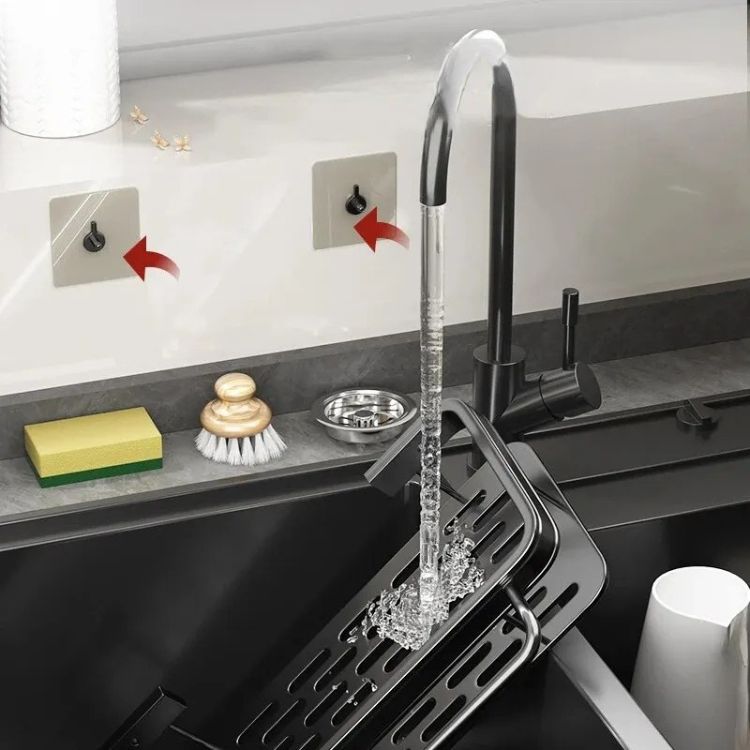 Sink drain rack with wall mounts near faucet.