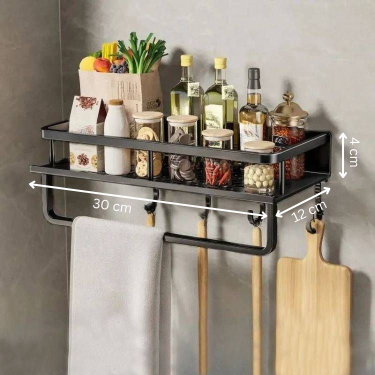 Spice rack organizer with multiple storage jars, utensils, and a towel.