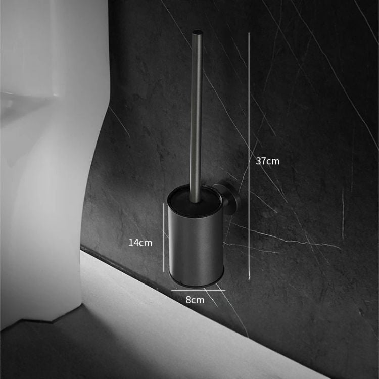 Black toilet brush holder with wall-mounted design next to toilet.