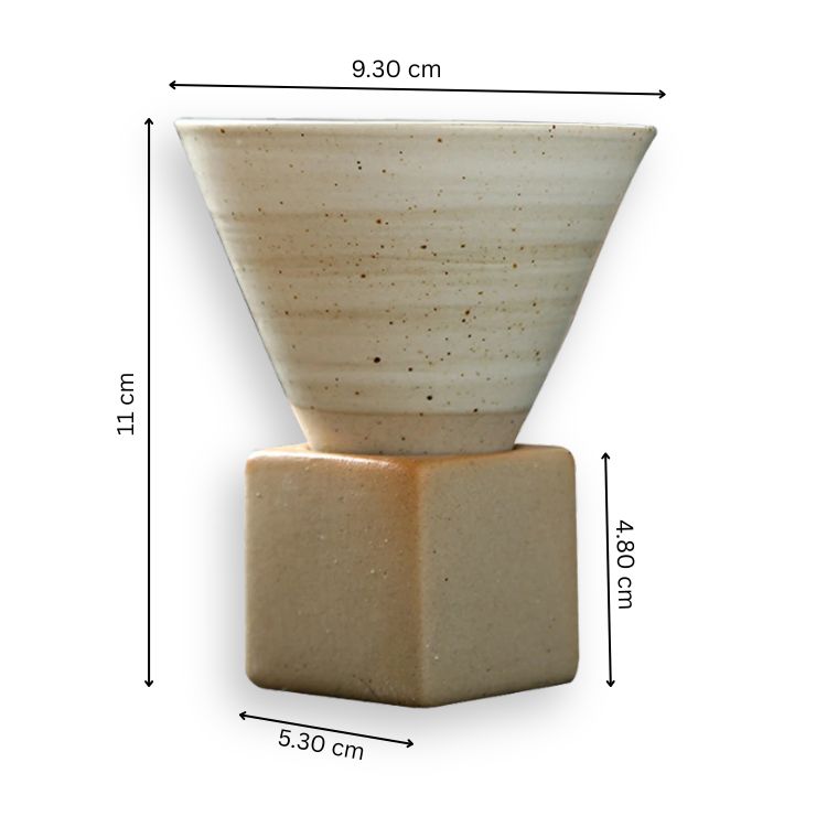 White, speckled ceramic cone coffee cup on a square wooden base, with dimensions.