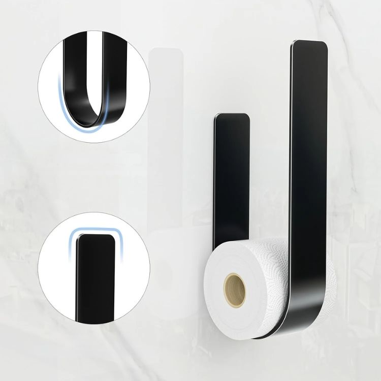 A black U-shaped toilet paper rack holding one roll, with a diagram showing its parts.