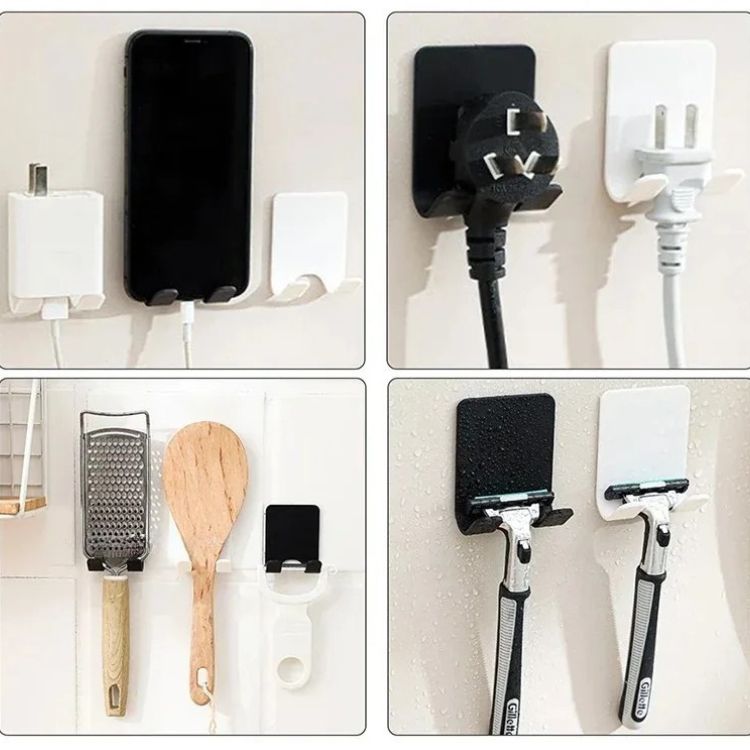 A minimalist black razor holder, mounted on a tiled wall.