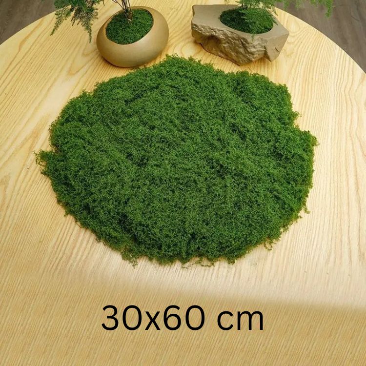 Decorative fake moss patch in 30x60 cm size placed on a wooden table with vases nearby.