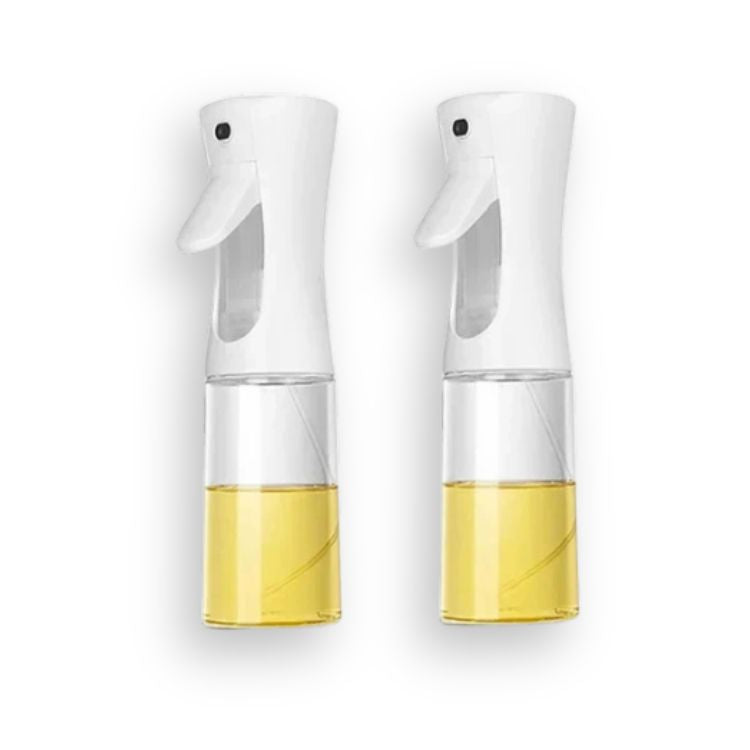 Two white oil sprayer bottles placed side by side, filled with yellow cooking oil.