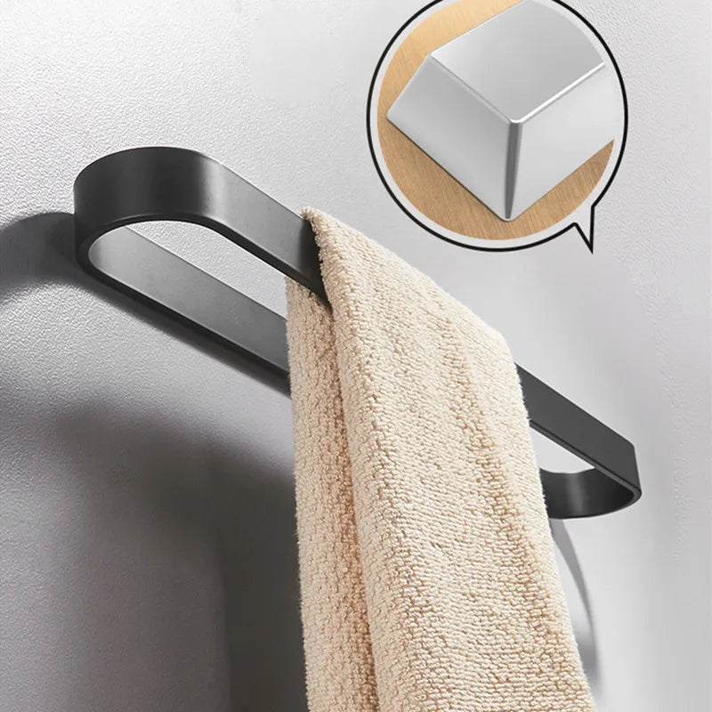 Black kitchen towel rack on a white wall, featuring an inset showing the rounded corner detail.