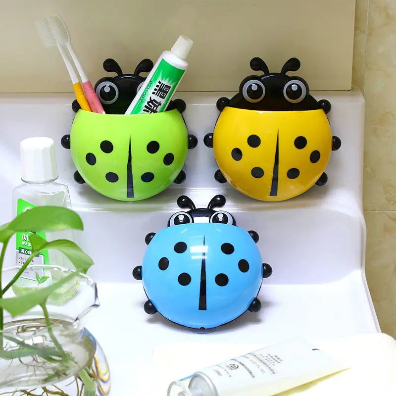Three ladybug-shaped toothpaste holders