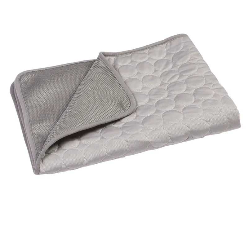 Grey dog cooling mats displayed together.