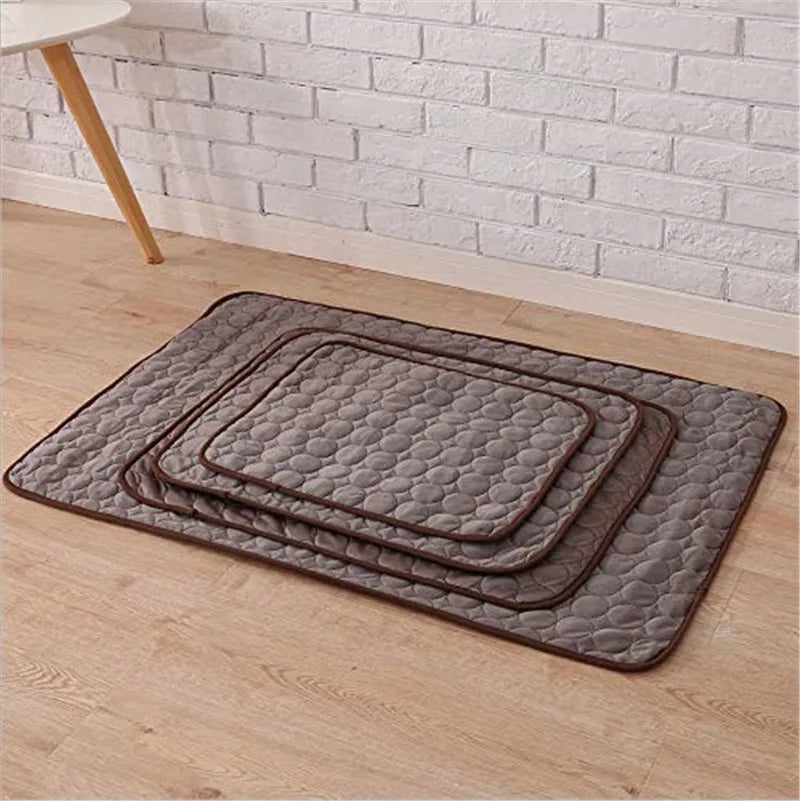 Brown dog cooling mat placed on wooden floor.