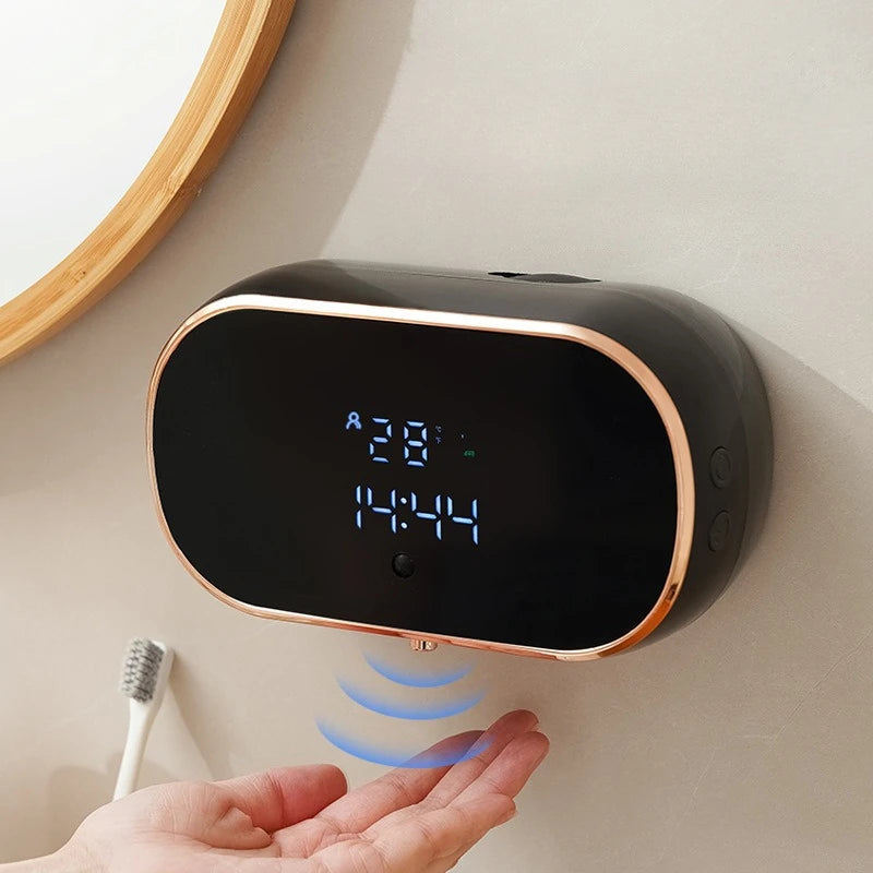 Black sensor soap dispenser dispensing foam.