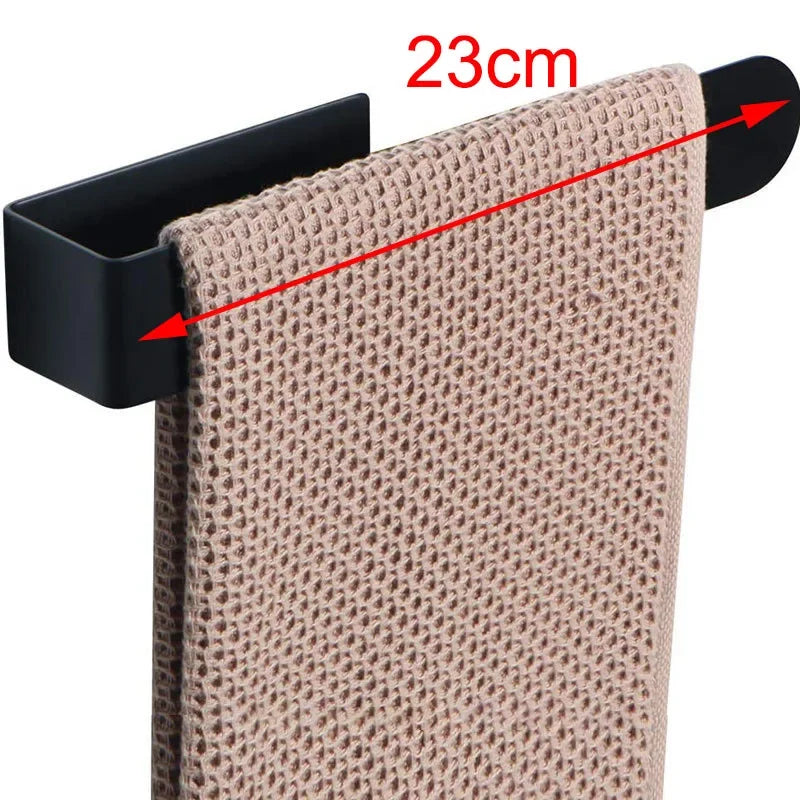 Adhesive towel ring with beige towel, 23cm width.