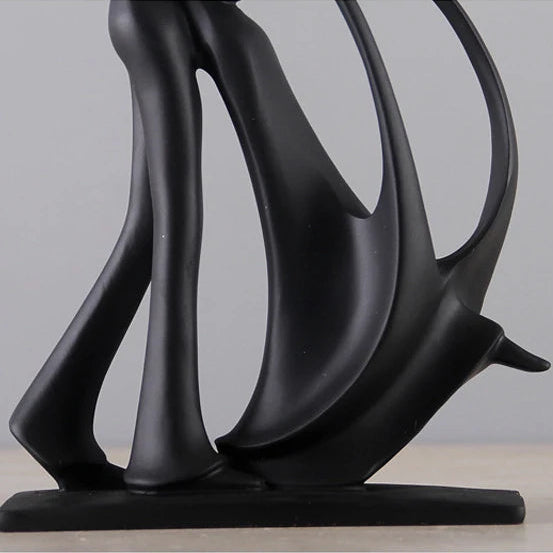 Base of black dancing figurine.