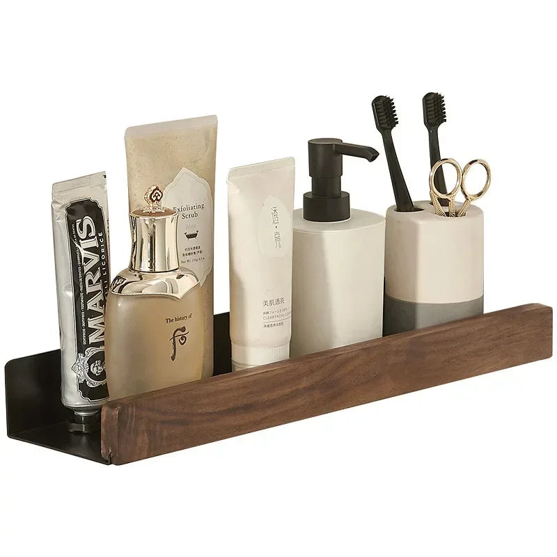 A floating wood shelf with bathroom products and toothbrushes.