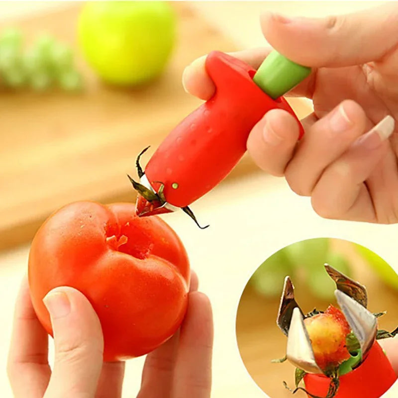 Fruit corer in use removing tomato stem in kitchen.