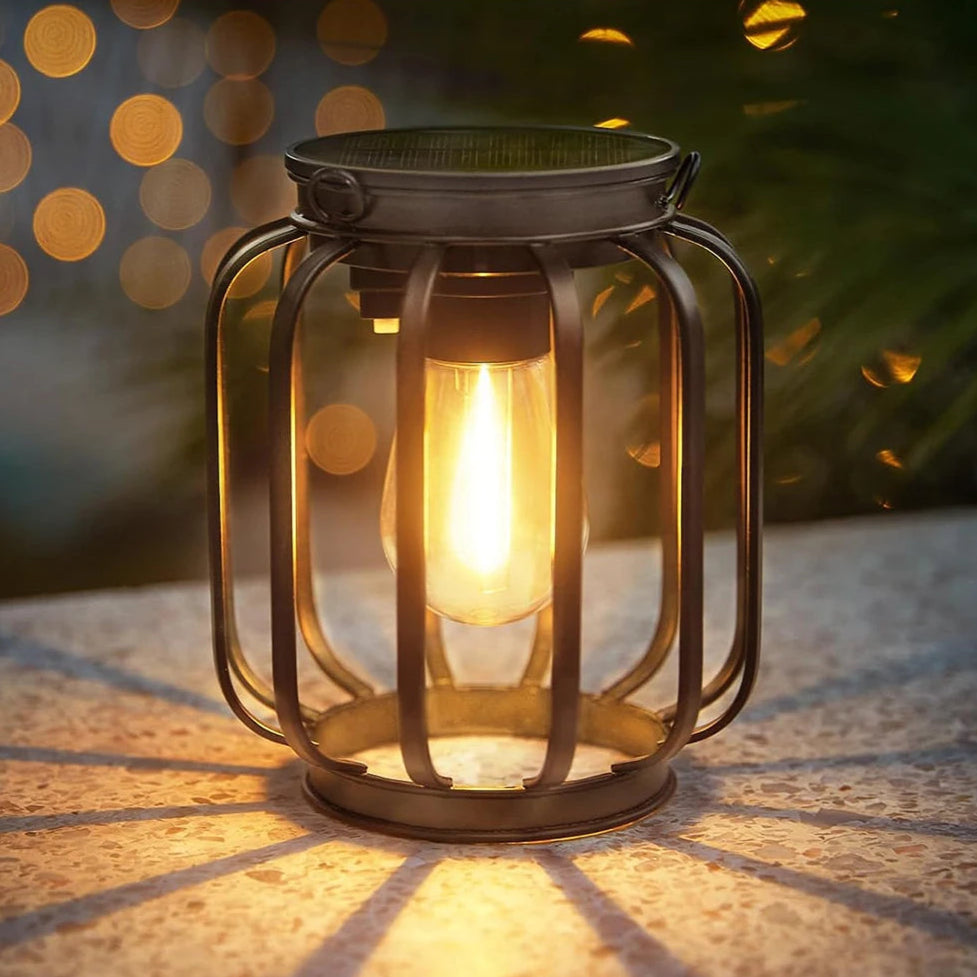 Glowing solar lantern on a stone surface at dusk.