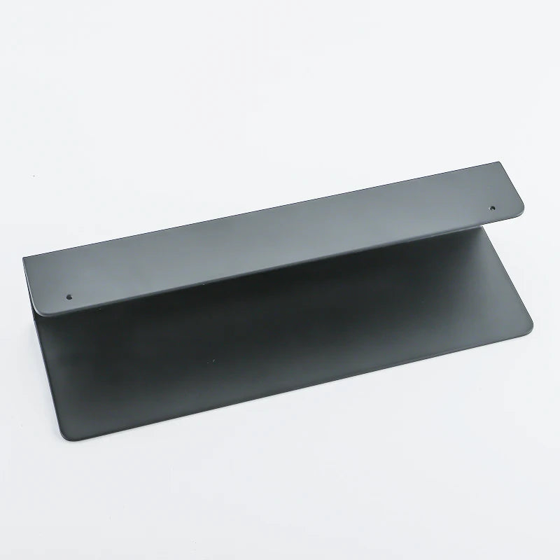 Black bathroom organizer shelf viewed from top angle.