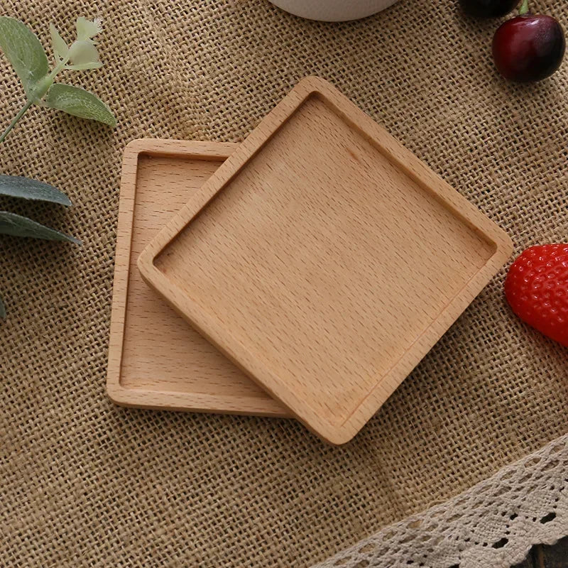 Light square wood coasters flipped to show the underside – wooden coaster.