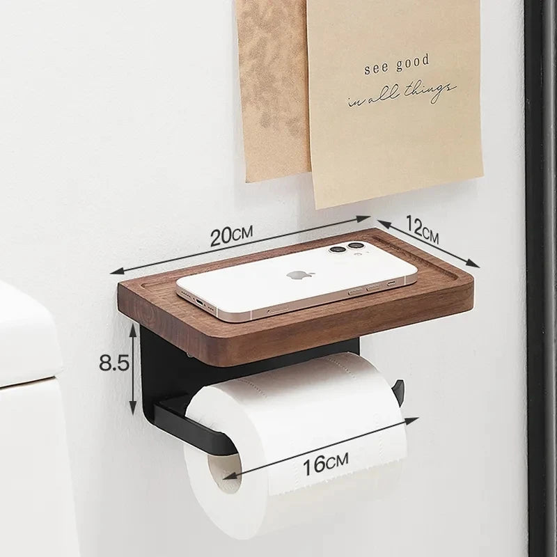 A wooden toilet paper holder with a small plant on its top