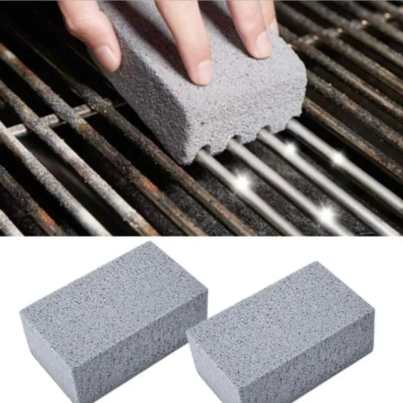 Hand using a grill cleaning brush block on metal grill grates.