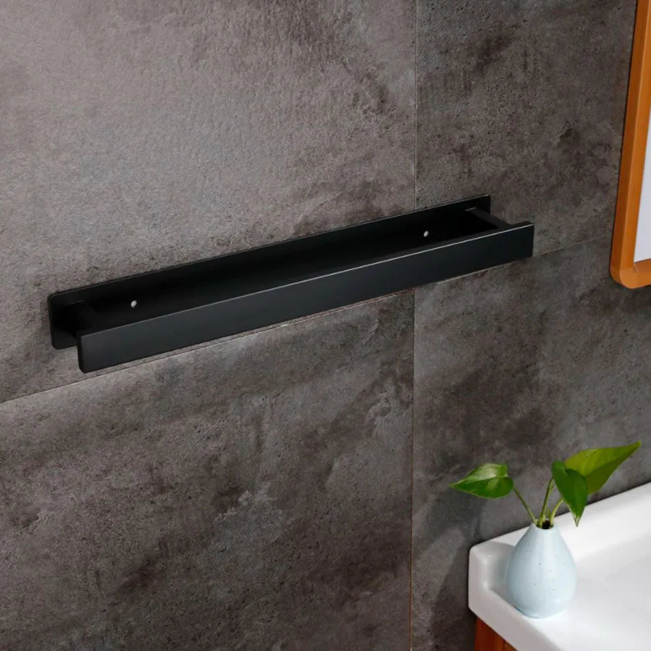 Wall-mounted black self adhesive towel rail above a bathroom sink.