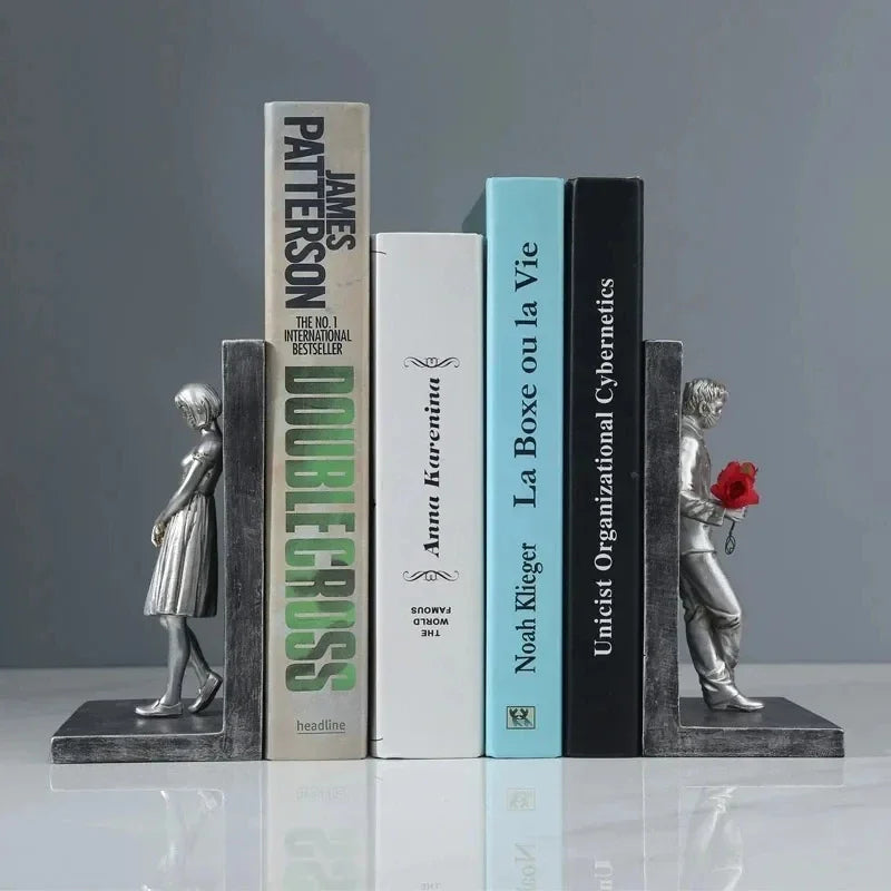 A black metal mesh bookshelf organizer containing various documents and folders.