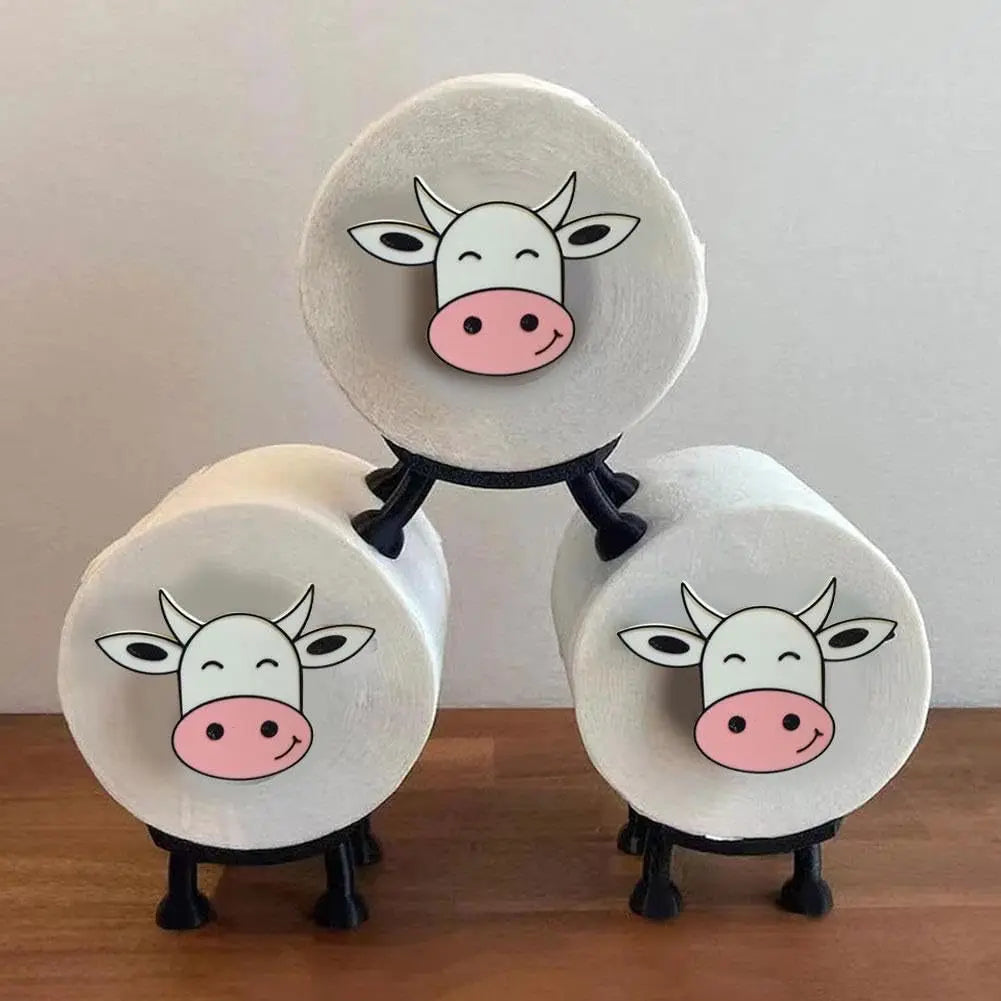A wall-mounted black toilet roll holder with a top shelf