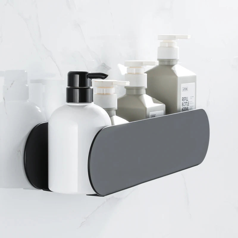 Wall-mounted black bathroom shelf organizer holding various pump bottles and containers.