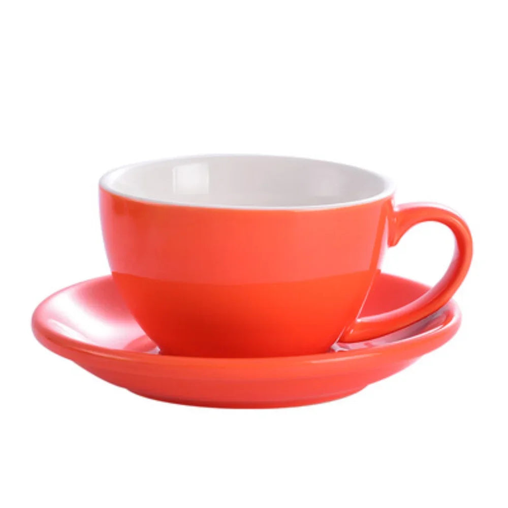 An orange ceramic mug with a white interior and matching saucer.